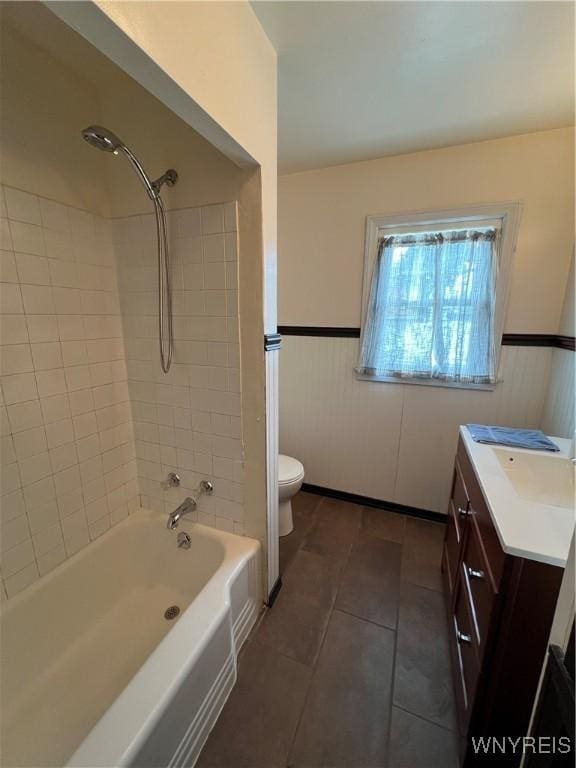 2479 Forest Ave, Niagara Falls, NY 14301 - bathroom featuring vanity, tile patterned floors, shower / washtub combination, and a wainscoted wall