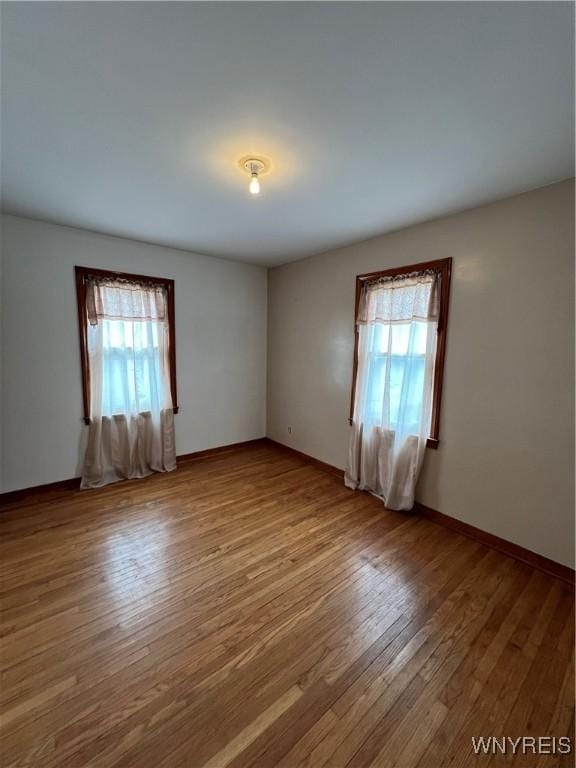 2479 Forest Ave, Niagara Falls, NY 14301 - empty room with plenty of natural light and wood finished floors