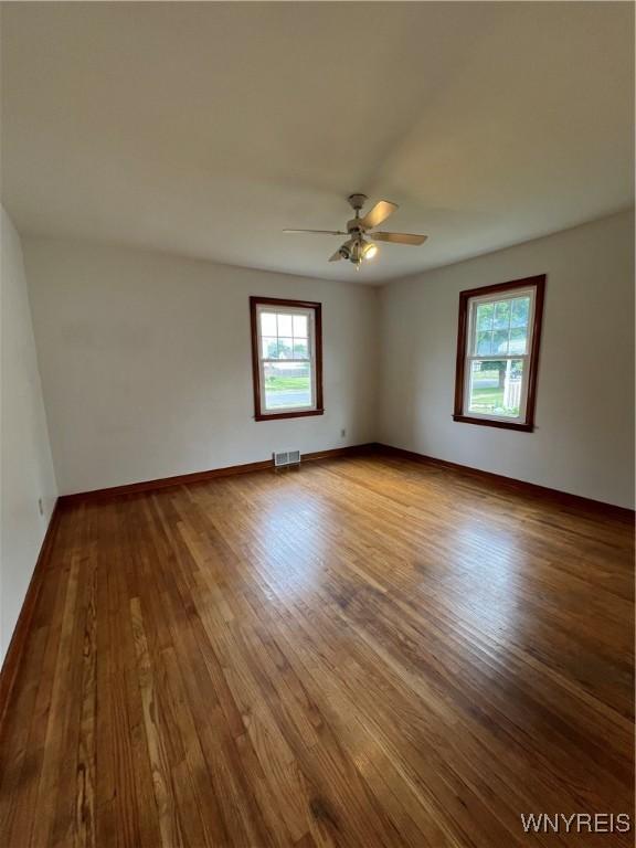 2479 Forest Ave, Niagara Falls, NY 14301 - empty room with wood finished floors and a ceiling fan
