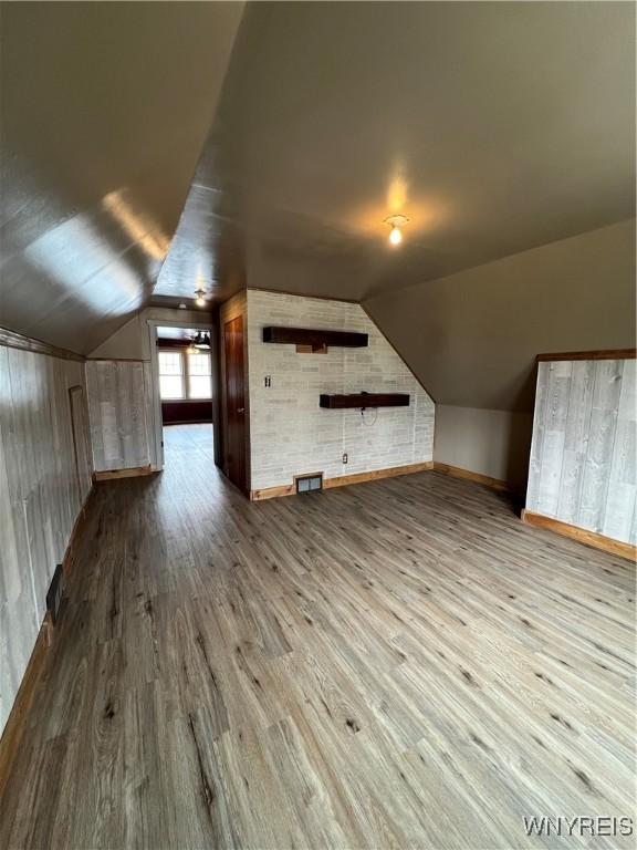 2479 Forest Ave, Niagara Falls, NY 14301 - additional living space with wood finished floors and vaulted ceiling