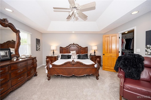 9 Rolling Woods Ln Unit E, West Seneca, NY 14224 - bedroom with light colored carpet, a spacious closet, a tray ceiling, a closet, and recessed lighting