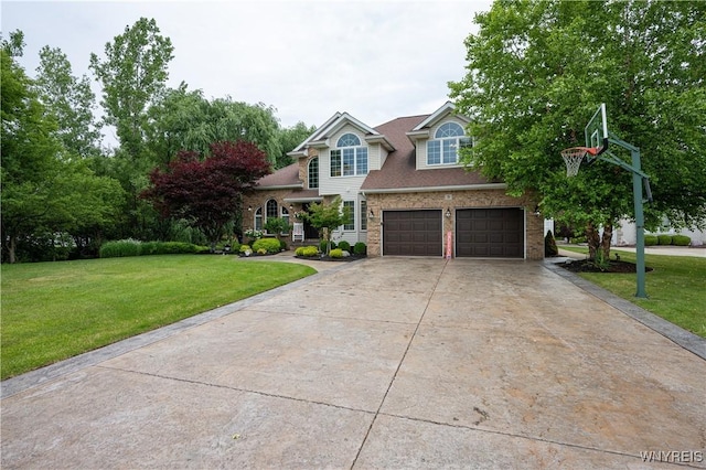 9 Rolling Woods Ln Unit E, West Seneca, NY 14224 - view of front facade featuring a garage, concrete driveway, and a front lawn
