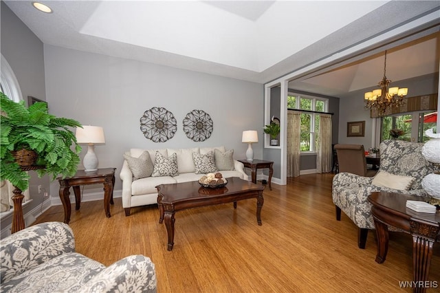 9 Rolling Woods Ln Unit E, West Seneca, NY 14224 - living room with light wood finished floors, a chandelier, and recessed lighting