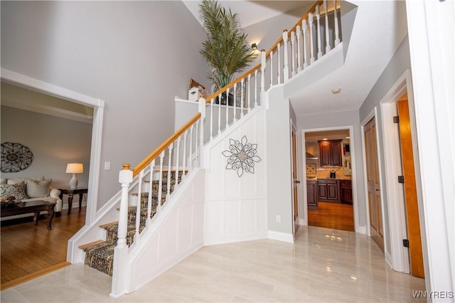 9 Rolling Woods Ln Unit E, West Seneca, NY 14224 - staircase with a towering ceiling
