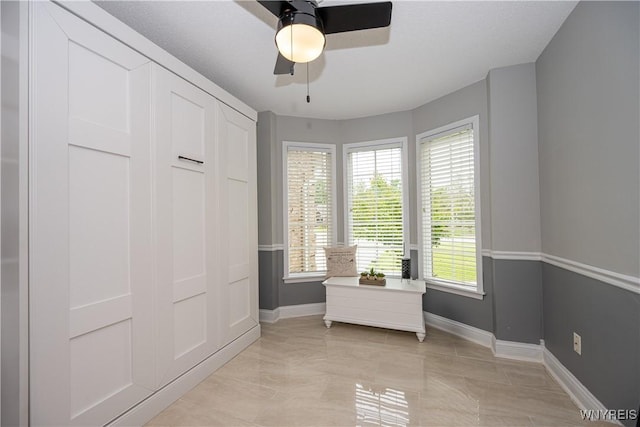 9 Rolling Woods Ln Unit E, West Seneca, NY 14224 - bedroom with baseboards and a ceiling fan