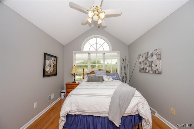 9 Rolling Woods Ln Unit E, West Seneca, NY 14224 - bedroom with wood finished floors, a ceiling fan, and lofted ceiling