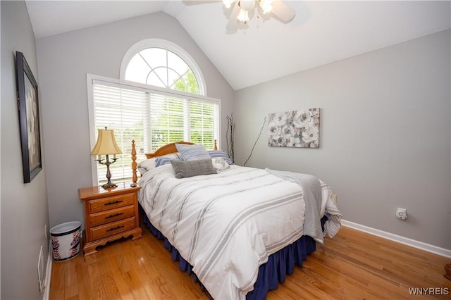 9 Rolling Woods Ln Unit E, West Seneca, NY 14224 - bedroom featuring light wood finished floors, vaulted ceiling, and a ceiling fan