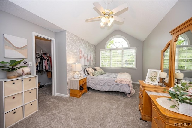9 Rolling Woods Ln Unit E, West Seneca, NY 14224 - bedroom featuring a walk in closet, vaulted ceiling, light carpet, multiple windows, and a closet
