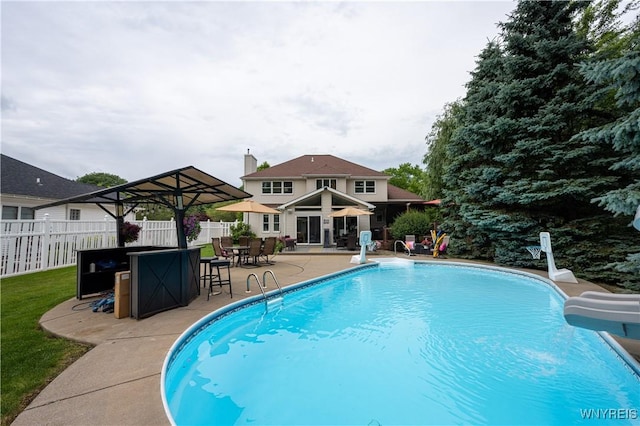 9 Rolling Woods Ln Unit E, West Seneca, NY 14224 - view of swimming pool featuring a water slide and a patio
