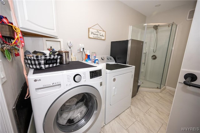 9 Rolling Woods Ln Unit E, West Seneca, NY 14224 - laundry area featuring cabinet space, washer and clothes dryer, and light marble finish flooring