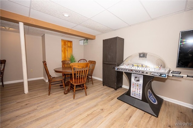 9 Rolling Woods Ln Unit E, West Seneca, NY 14224 - dining area featuring light wood-type flooring and a paneled ceiling