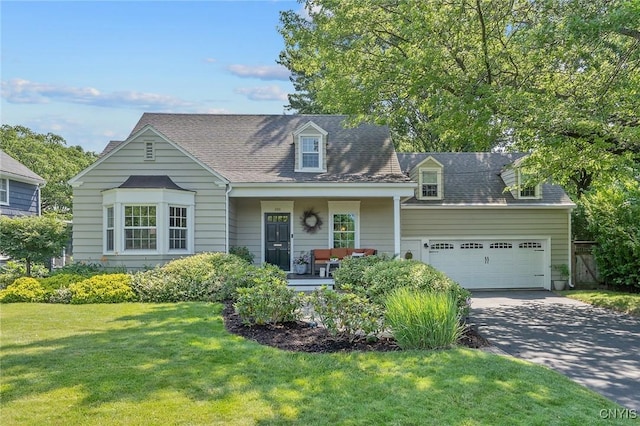 200 Halton Rd, Dewitt, NY 13224 - cape cod-style house with a porch, a front yard, an attached garage, and concrete driveway