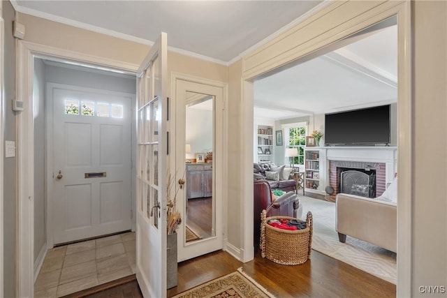 200 Halton Rd, Dewitt, NY 13224 - entryway with a fireplace, crown molding, and wood finished floors