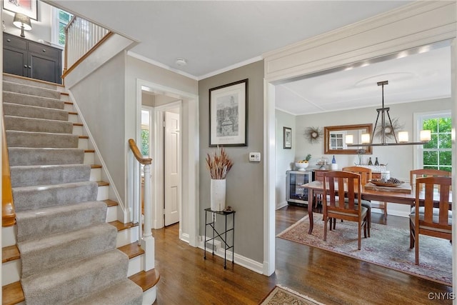 200 Halton Rd, Dewitt, NY 13224 - staircase with wood finished floors, beverage cooler, ornamental molding, and a chandelier