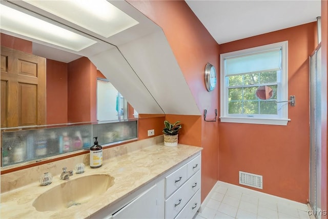 200 Halton Rd, Dewitt, NY 13224 - bathroom featuring vanity, lofted ceiling, and tile patterned flooring