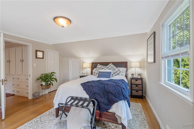 200 Halton Rd, Dewitt, NY 13224 - bedroom featuring light wood-style floors and vaulted ceiling