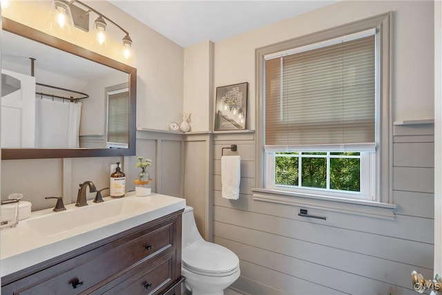 200 Halton Rd, Dewitt, NY 13224 - bathroom with vanity, a decorative wall, a wainscoted wall, and a shower with shower curtain