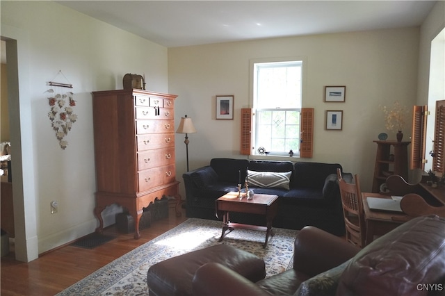 64 Bunner St, Oswego, NY 13126 - living area featuring wood finished floors and baseboards