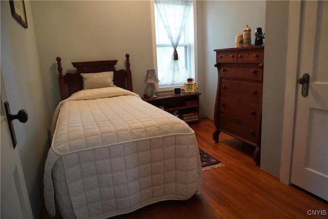 64 Bunner St, Oswego, NY 13126 - bedroom featuring wood finished floors