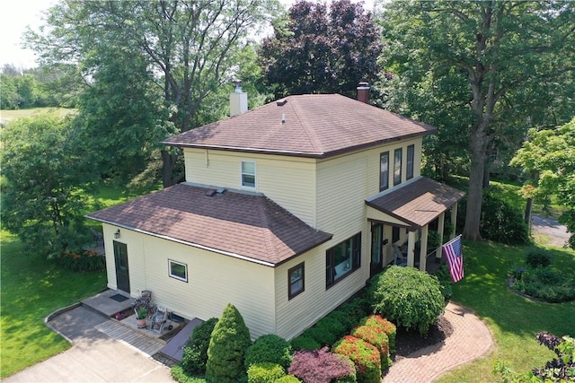 64 Bunner St, Oswego, NY 13126 - view from above of property with a tree filled landscape