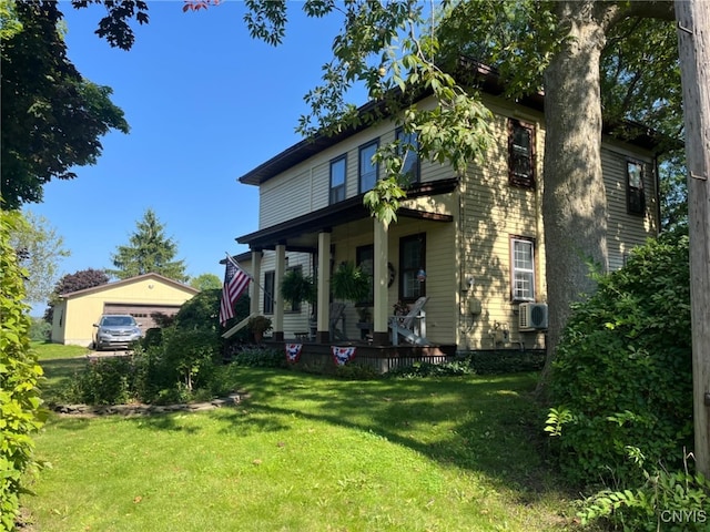 64 Bunner St, Oswego, NY 13126 - view of front of house featuring covered porch, a front lawn, an outbuilding, and cooling unit