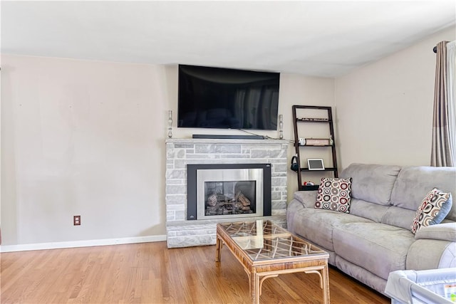 5 Tudor Dr, Owego, NY 13760 - living room with wood finished floors and a fireplace