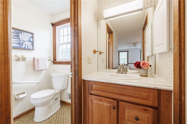 326 Cheese Factory Rd, Mendon, NY 14472 - half bathroom featuring vanity, wallpapered walls, and plenty of natural light