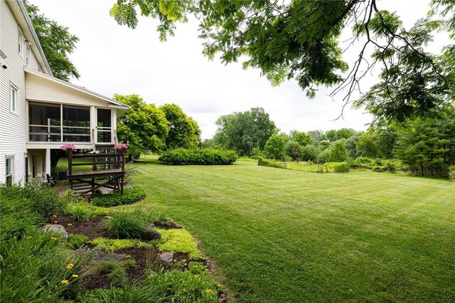 326 Cheese Factory Rd, Mendon, NY 14472 - view of green lawn featuring a sunroom