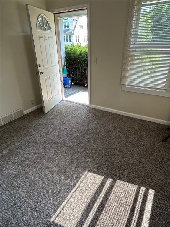 472 Seneca Rd, Irondequoit, NY 14622 - carpeted foyer entrance featuring baseboards
