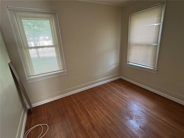 472 Seneca Rd, Irondequoit, NY 14622 - spare room with wood finished floors and baseboards