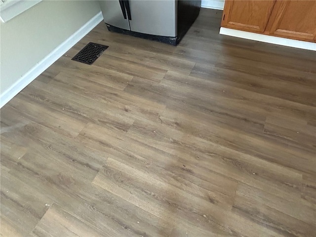 472 Seneca Rd, Irondequoit, NY 14622 - kitchen view of dark wood finished floors, brown cabinets, and range