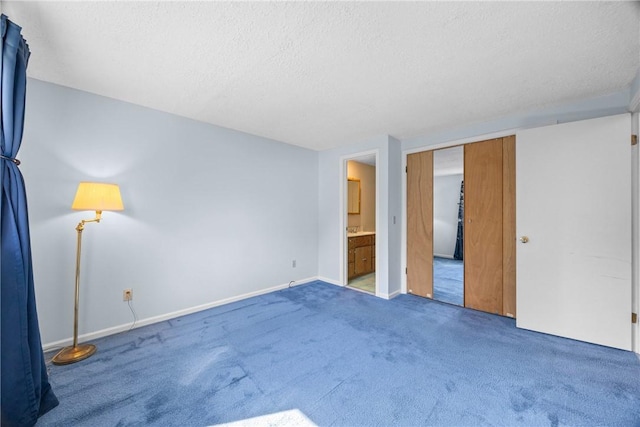 1521 Aster Ter, Walworth, NY 14568 - unfurnished bedroom featuring a textured ceiling, carpet, and ensuite bathroom