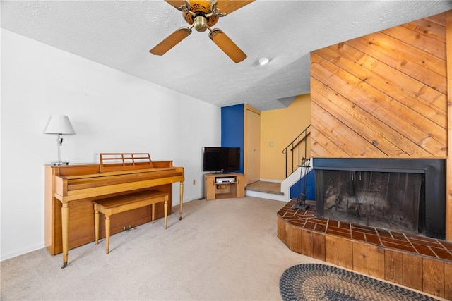 1521 Aster Ter, Walworth, NY 14568 - carpeted living room with ceiling fan, a textured ceiling, and stairs