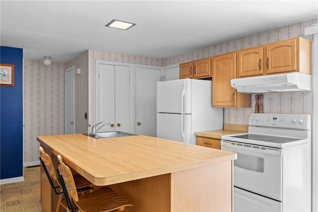 1521 Aster Ter, Walworth, NY 14568 - kitchen featuring white appliances, under cabinet range hood, wallpapered walls, light countertops, and a kitchen breakfast bar