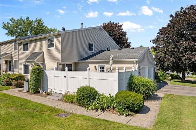 1521 Aster Ter, Walworth, NY 14568 - view of property exterior featuring an attached garage and driveway