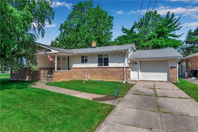 566 Adam St, Tonawanda, NY 14150 - view of front of house featuring brick siding, a garage, a front yard, and concrete driveway