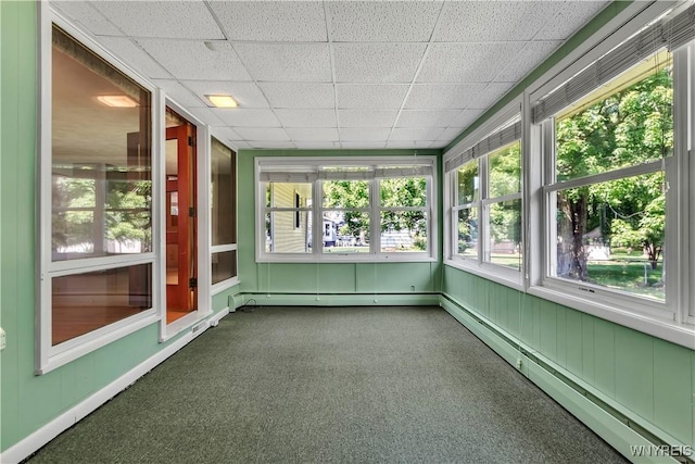 566 Adam St, Tonawanda, NY 14150 - unfurnished sunroom with carpet, a baseboard radiator, a drop ceiling, and a baseboard heating unit