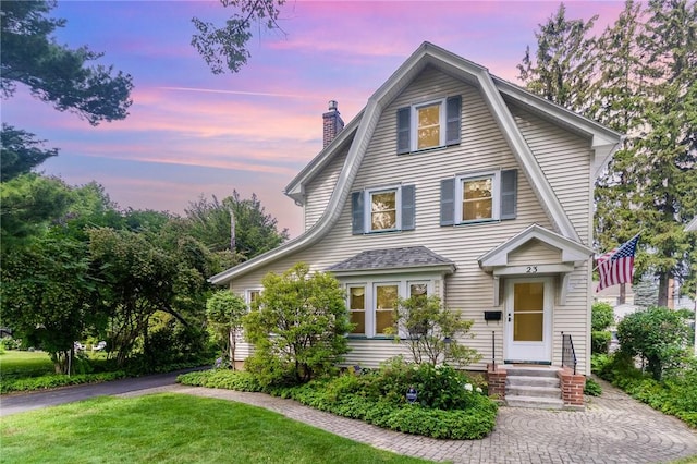 23 Hathaway Rd, Irondequoit, NY 14617 - view of front of home featuring a chimney, a front lawn, and entry steps