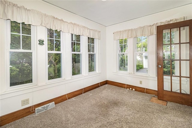 23 Hathaway Rd, Irondequoit, NY 14617 - unfurnished sunroom with carpet flooring and baseboards