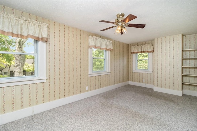 23 Hathaway Rd, Irondequoit, NY 14617 - empty room with carpet floors, a ceiling fan, and a textured ceiling