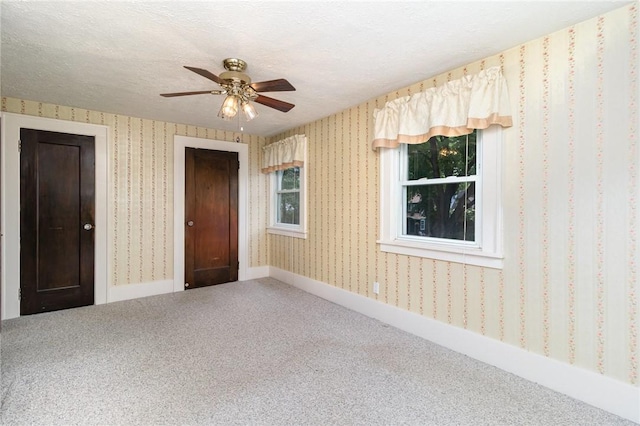 23 Hathaway Rd, Irondequoit, NY 14617 - spare room featuring carpet, a ceiling fan, a textured ceiling, and wallpapered walls