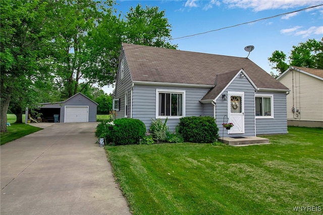 3029 Stieg Rd, Wheatfield, NY 14120 - view of front of home featuring a garage, an outdoor structure, a front lawn, roof with shingles, and concrete driveway