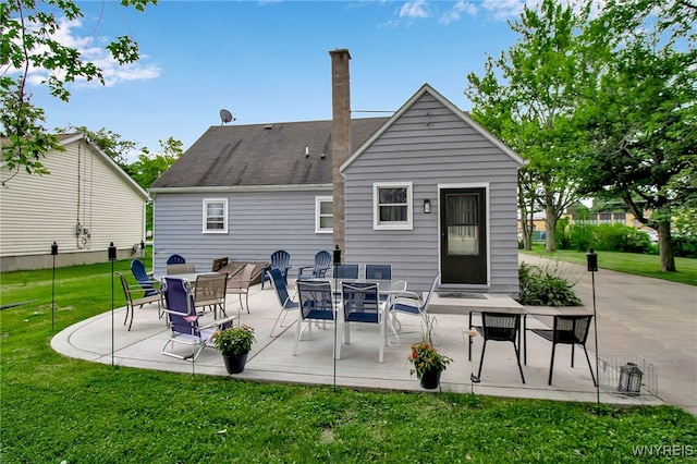 3029 Stieg Rd, Wheatfield, NY 14120 - rear view of property featuring a patio area, a lawn, a chimney, and roof with shingles