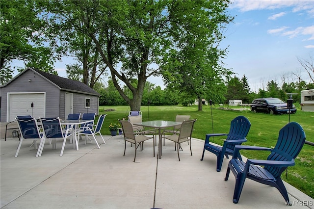 3029 Stieg Rd, Wheatfield, NY 14120 - view of patio with outdoor dining space, an outdoor structure, and a garage