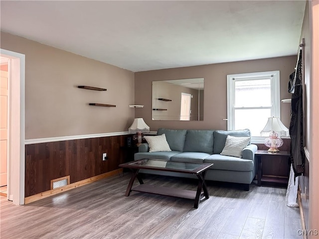 9 Curtis Ave, Lysander, NY 13027 - living room featuring wood finished floors and wainscoting