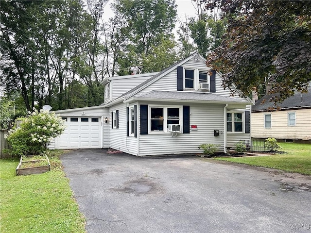 9 Curtis Ave, Lysander, NY 13027 - view of front of house with an attached garage, asphalt driveway, cooling unit, and a front yard