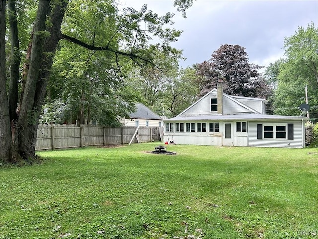9 Curtis Ave, Lysander, NY 13027 - rear view of house featuring a fire pit and a chimney