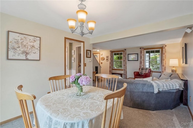 22 Tree Line Dr, Clay, NY 13090 - dining area with a chandelier and carpet floors