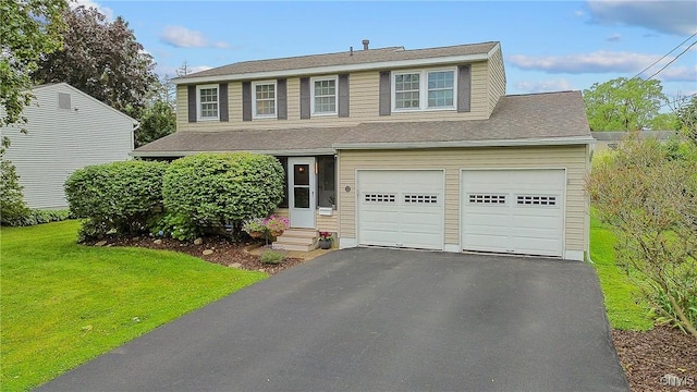 22 Tree Line Dr, Clay, NY 13090 - traditional home featuring entry steps, a front lawn, asphalt driveway, and a garage