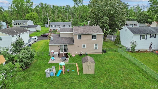 22 Tree Line Dr, Clay, NY 13090 - rear view of property with a patio area, a residential view, a storage unit, a fenced backyard, and roof with shingles